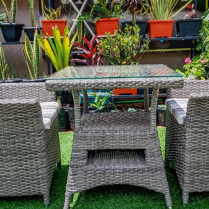 Side view of the Fox Glove rattan dining set showing the storage shelf beneath the tempered glass tabletop.
